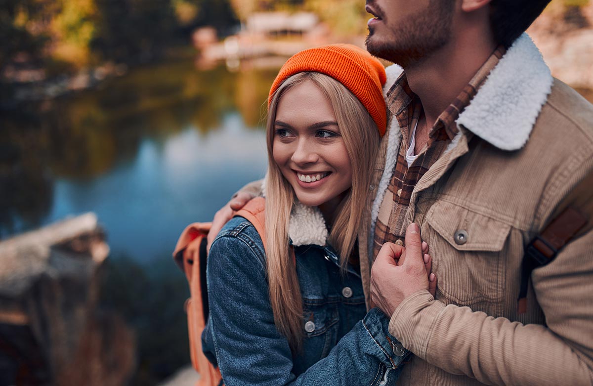 young-couple-hiking-near-lake